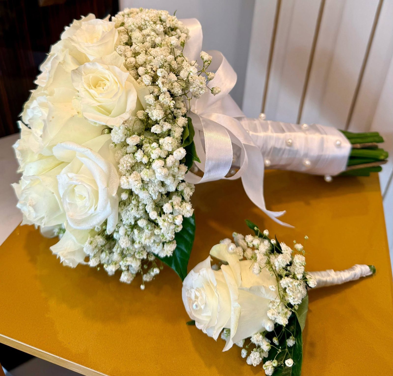 White rose and wax flower bridal bouquet, side angle