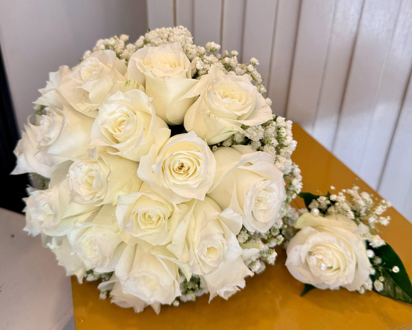 White rose and wax flower bridal bouquet, top view
