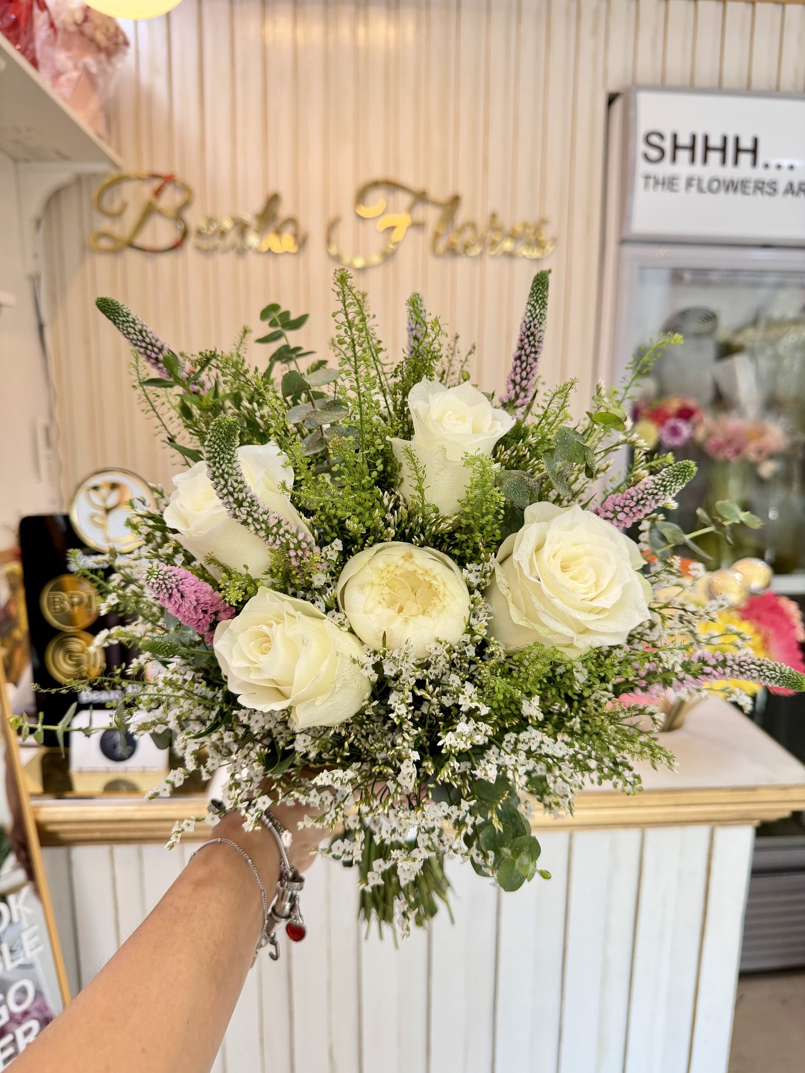 White rose and peony bridal bouquet with lavender accents