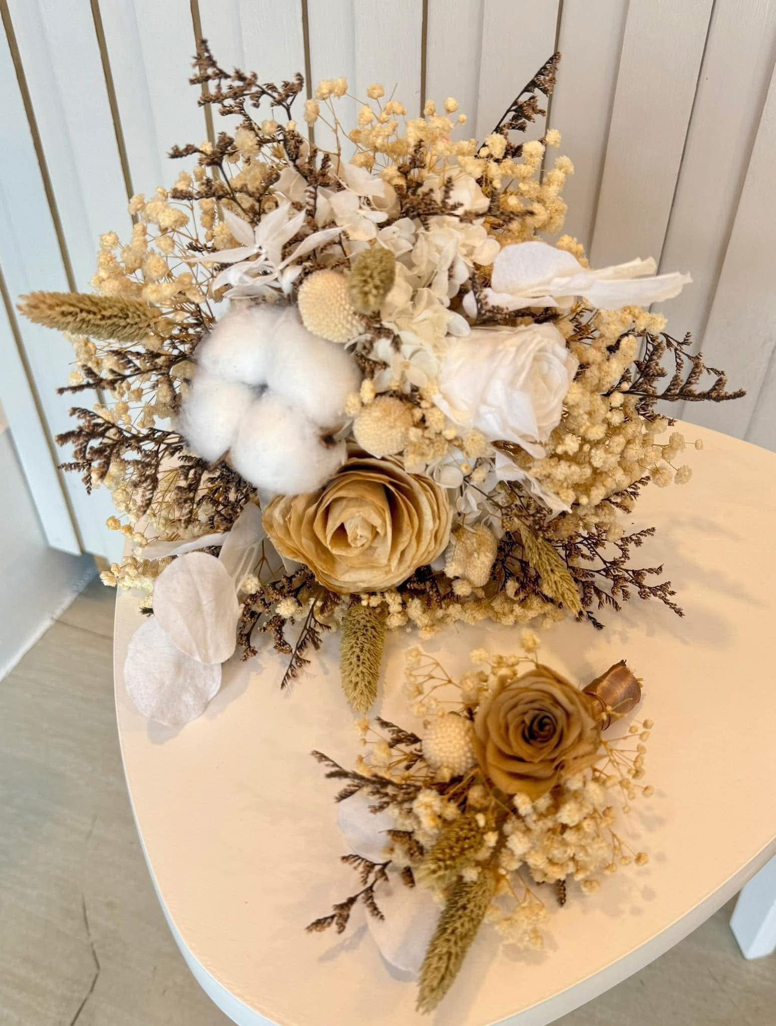 Preserved cotton, hydrangea, and dried rose bridal bouquet with matching boutonniere
