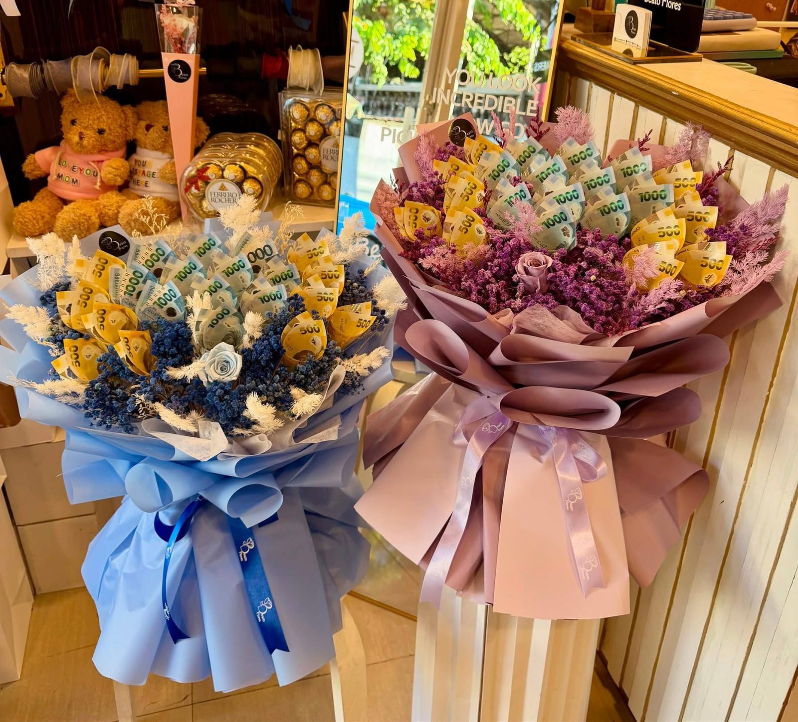 Blue and dusty rose money bouquets with peso bills